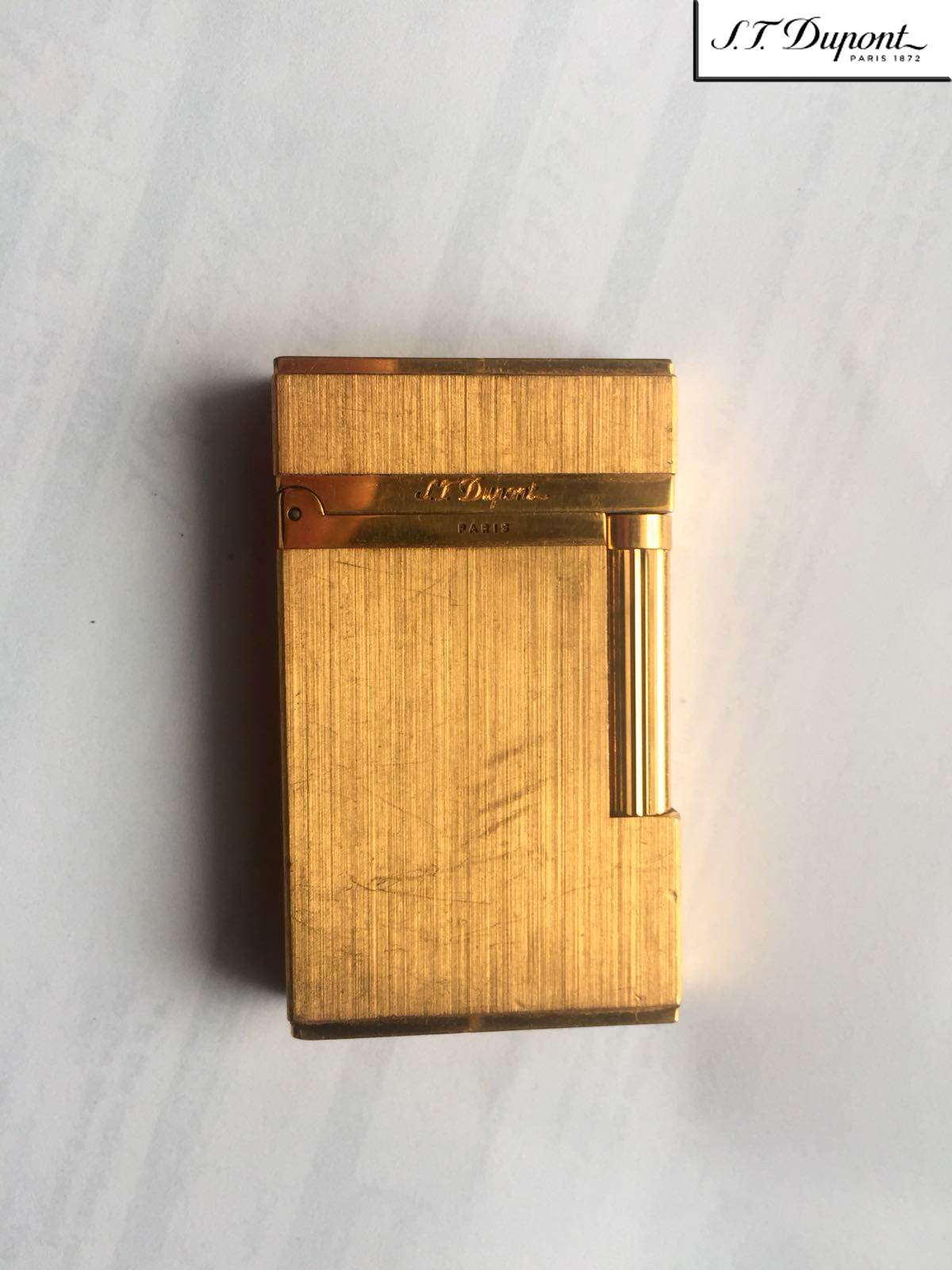 S. T. Dupont 1FKCE82 Gold Lighter.Used.  www.a2900.com  a2900 store Online. Canada. USA. S. T. Dupont 1FKCE82 Запальничка золота. Що була у використанні. S. T. Dupont 1FKCE82 Зажигалка золотая. Бывшая в употреблении. 